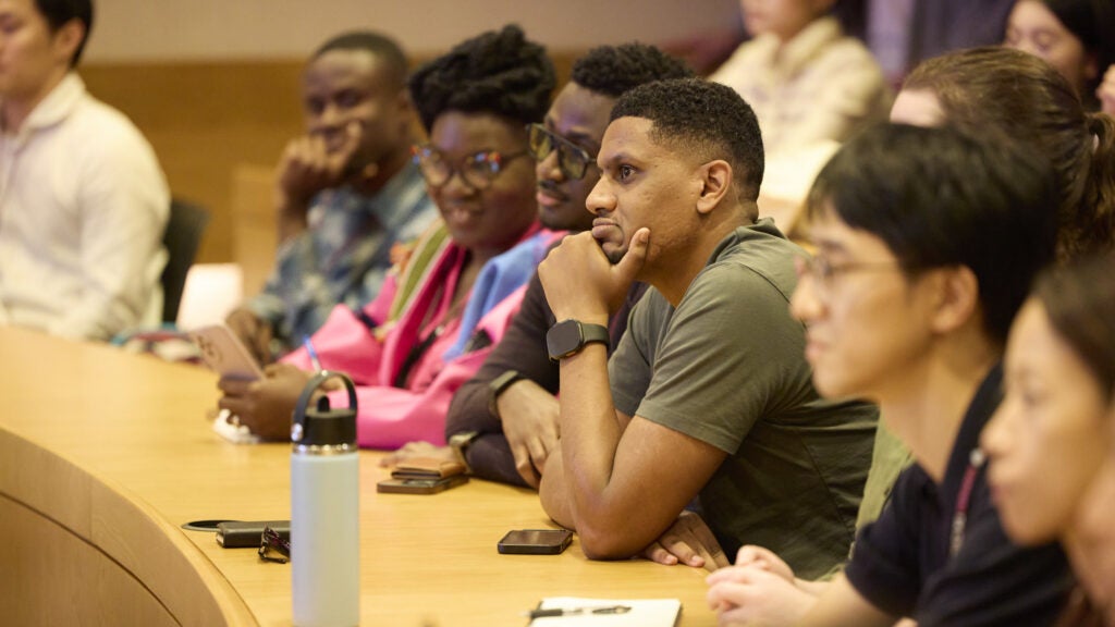 Students listen to a presentation