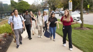 A tour guide leads a group