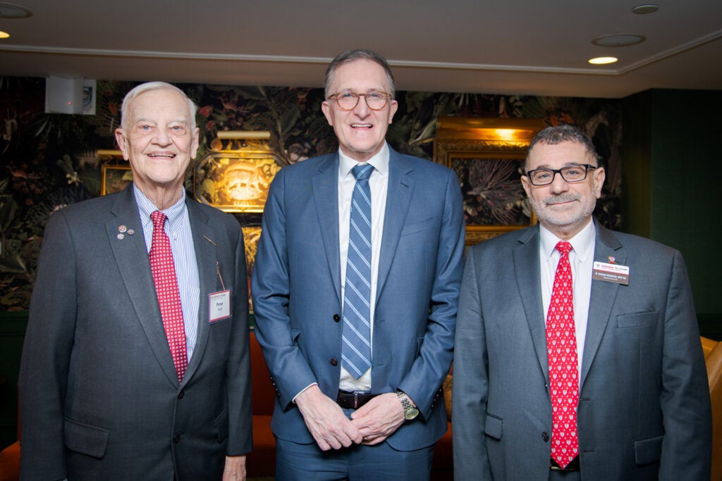 Peter Hutt, Dean Andrea Baccerelli, and Rashad Massoud, pose for a photo. 