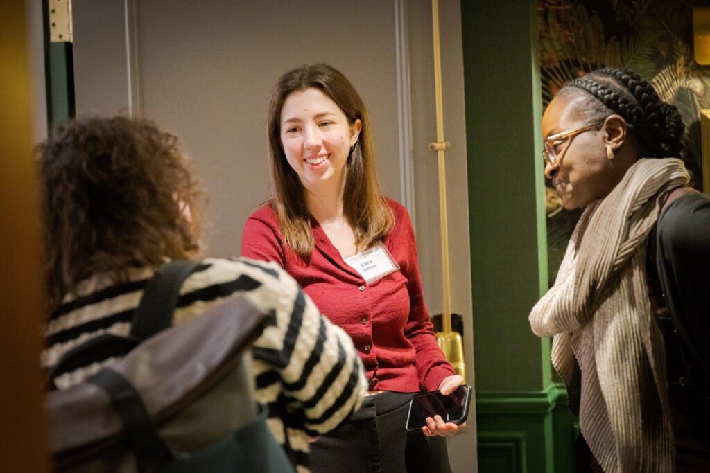 Three women in conversation.