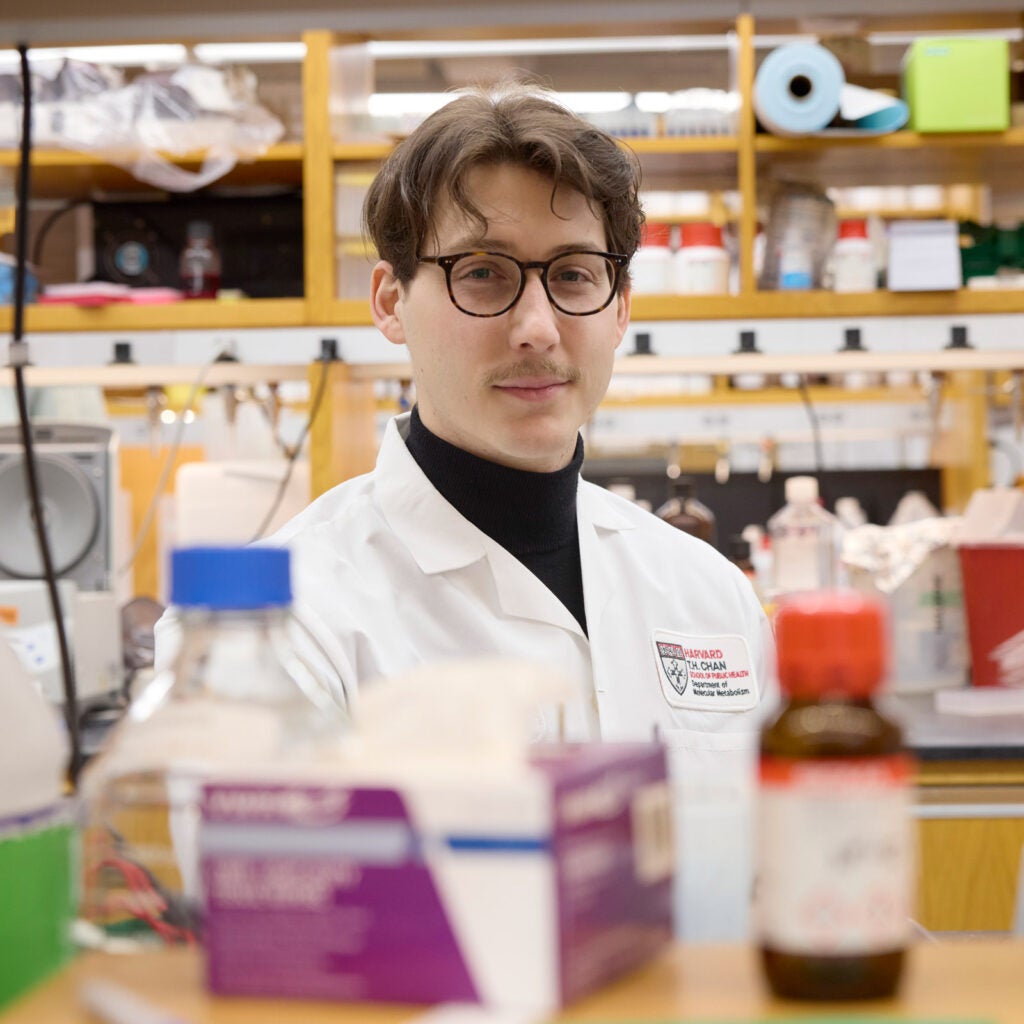 Environmental headshot of Sam Lapp, taken in a lab. 