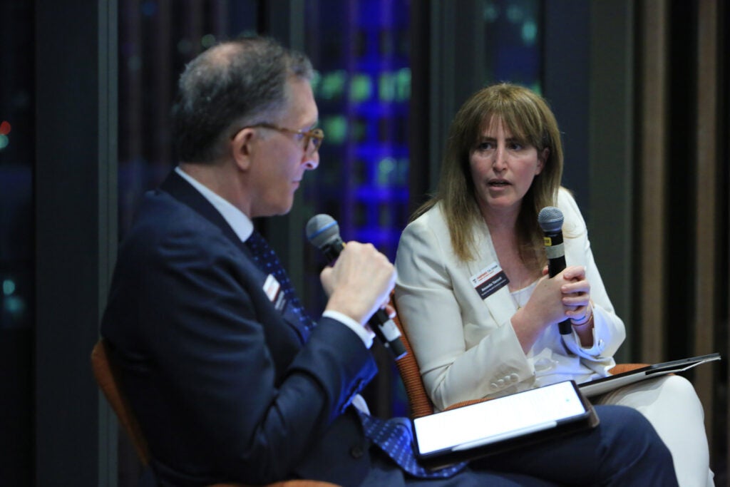 Amanda Yarnell and Andrea Baccerelli in conversation on a panel.