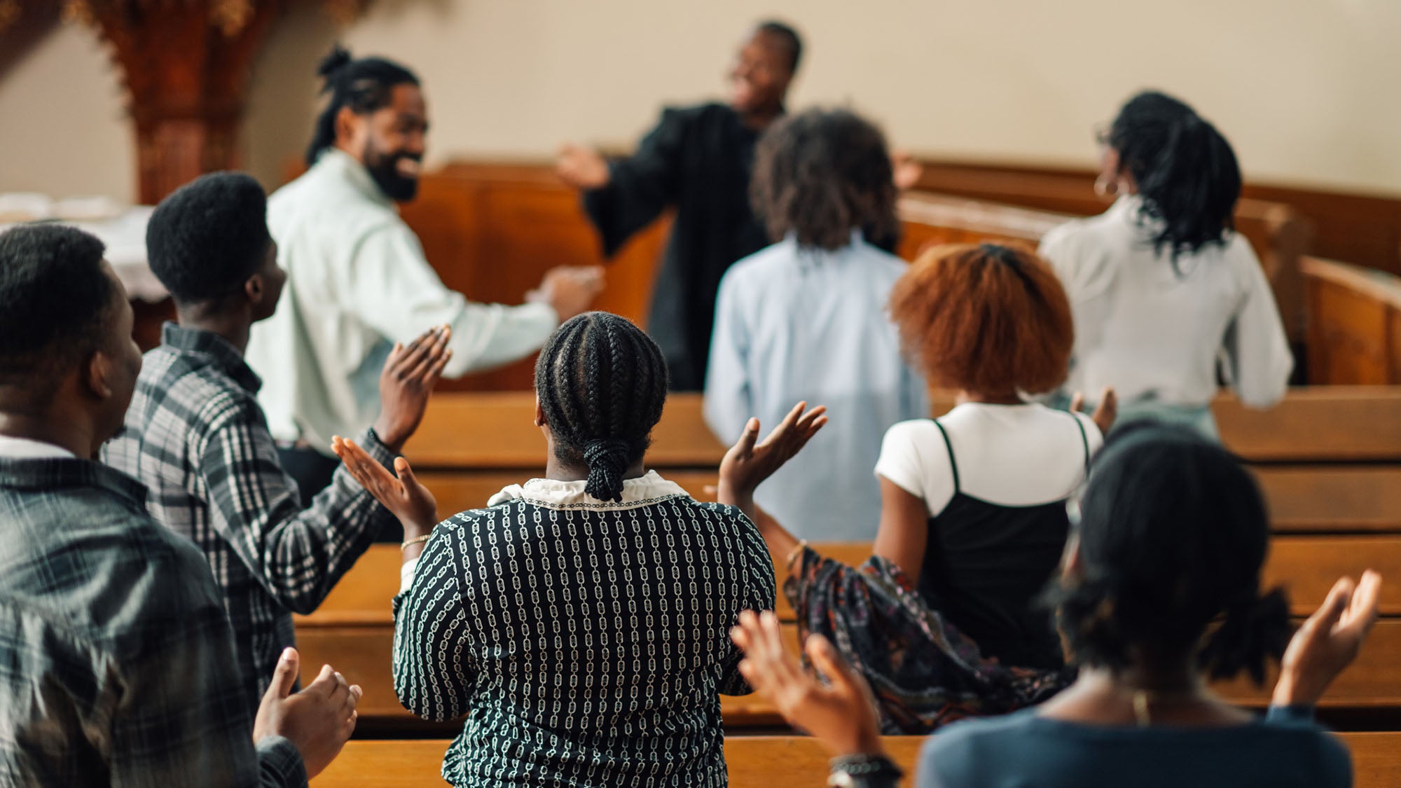 People gathered in pews at church.