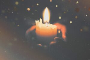 Candle in hands