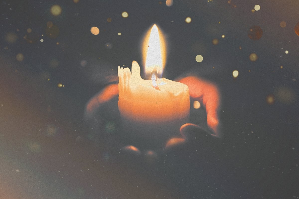 Candle in hands
