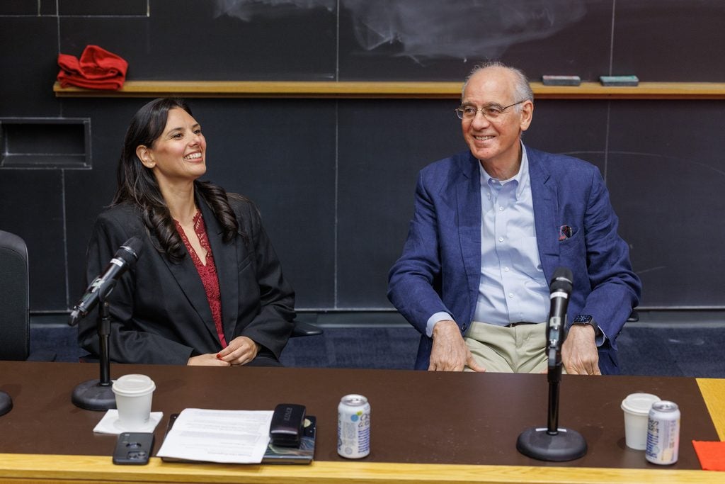 Heather Mattie and Rifat Atun smile while presenting their session on the Harvard Chain Advanced Learning Academy. 
