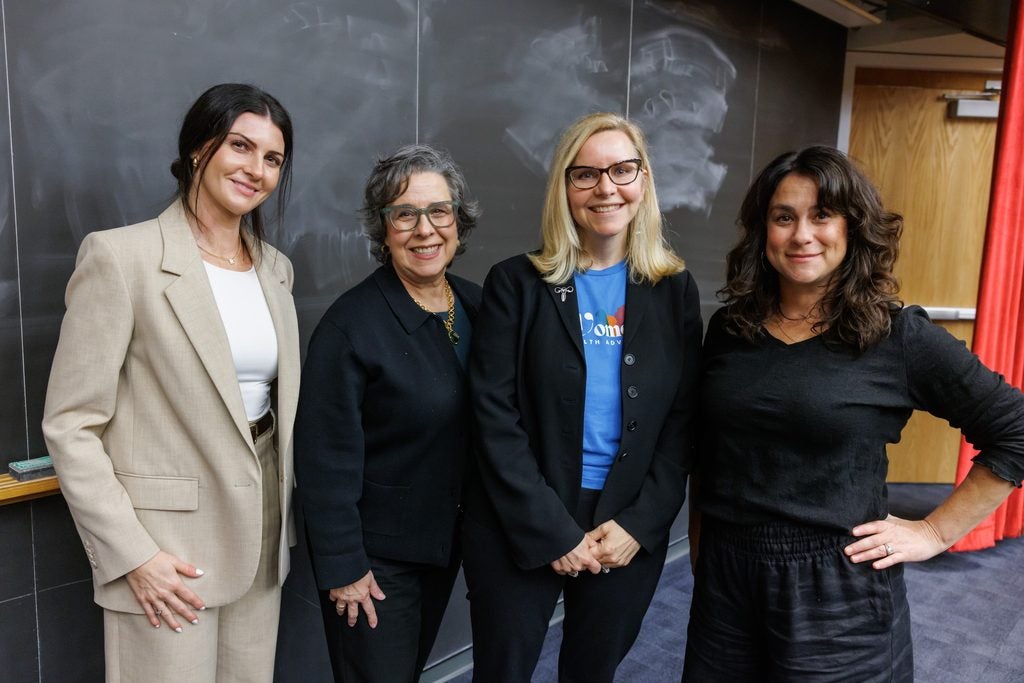 Elizabeth Garner, Liz Powell, Kathryn Rexrode, and Jessica Cohen pose together after their panel on women's health. 